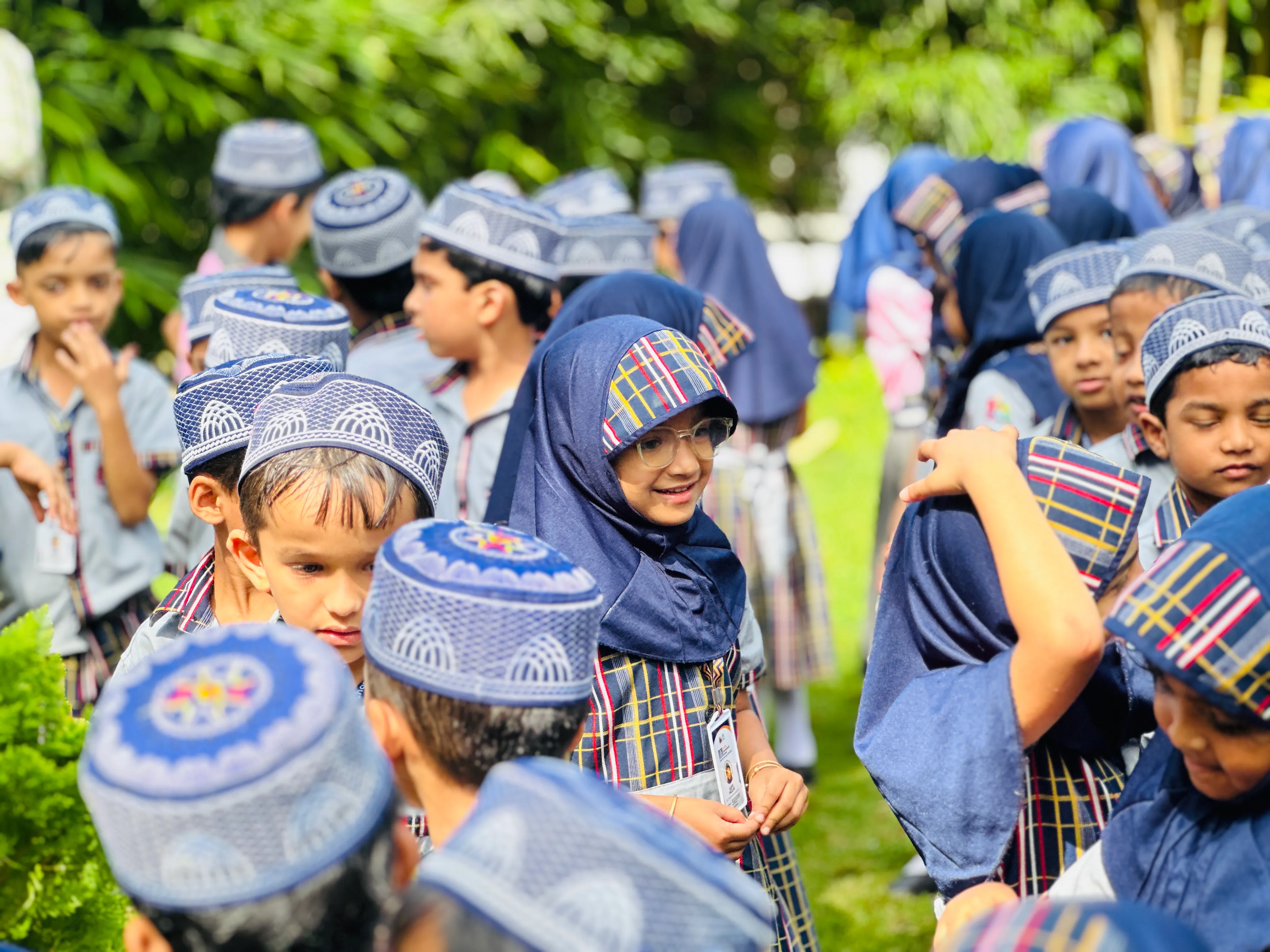 Little champions participating in Annual Sports Day on the main playground at ZeeQue Preschool in Kerala.